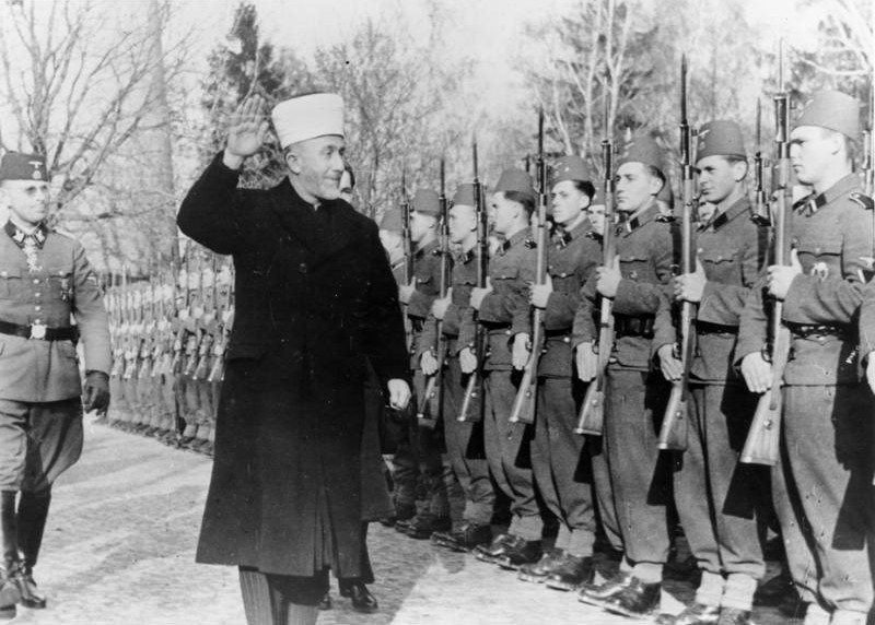 Muslim leader Haj Amin al-Husseini, alongside Nazi General Karl-Gustav Sauberzweig, reviewing Bosnian Muslim SS volunteers during their training in November 1943